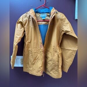 Columbia Kids Mustard Rain Jacket With Hood. Blue interior mesh liner.